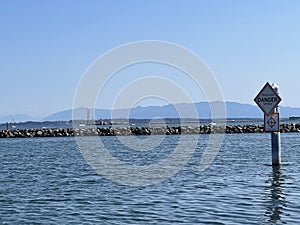 Danger Shallow Water Sign in Anacortes Washington USA Harbor Sunny Day