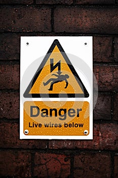 Danger sign on a brick wall