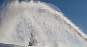 Danger sign, covered with snow, on the Sunny day, on top of Rose Peak mountain