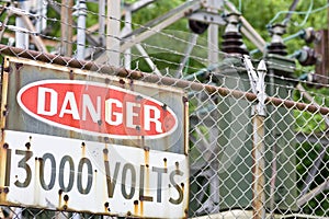 Danger sign in front of high voltage equipment