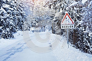 Danger sign on icy road