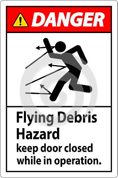 Danger sign indicating the risk of flying debris, advising to keep the door closed