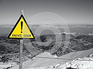 Danger sign on mountain