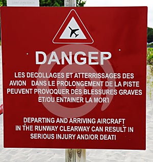 Danger sign next to runway at Gustaf III Airport at St Barts , French West Indies