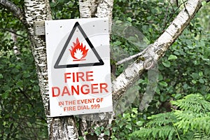 Danger sign notice in the event of fire call emergency services