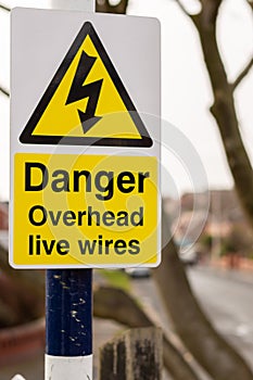 Danger sign overhead wires