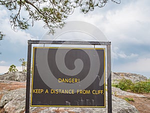 Danger sign on Phu Kradueng mountain national park in Loei City Thailand.