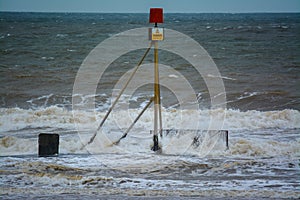 Danger sign and rough sea