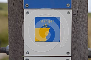 Danger sign on steep coast near Wissant photo