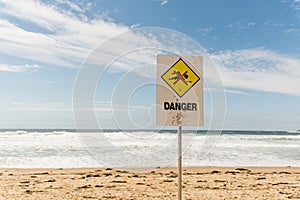 Danger sign for swimmers at the beach in Australia