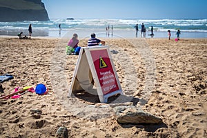 Danger sign warning beach users in Cornwall, UK