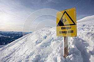 Danger steep cliff mountain sign