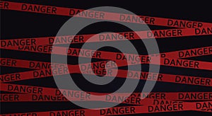 Danger tape in dark background