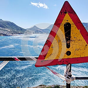 Danger warning sign on cliff