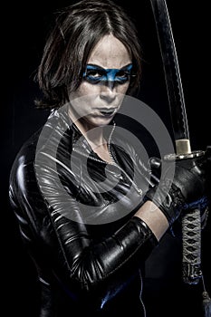 Danger, Woman with katana sword in latex costume