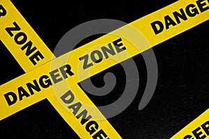 Danger zone caution and warning concept. Yellow barricade tape with word.