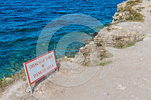 Danger zone keep out wooden sign panel posted in the wilderness. concept of travel and outdoor activity.