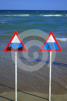 Danger zone signs on the beach