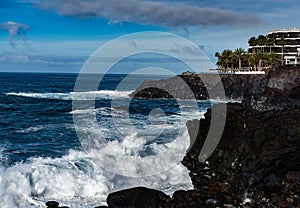 Dangerious ocean stormy waves hits black lava rocks on La Palma island, Canary, Spain