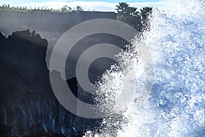 Dangerious ocean stormy waves hits black lava rocks on La Palma island, Canary, Spain