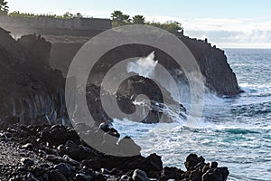 Dangerious ocean stormy waves hits black lava rocks on La Palma island, Canary, Spain