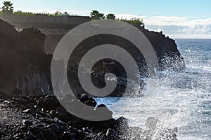 Dangerious ocean stormy waves hits black lava rocks on La Palma island, Canary, Spain