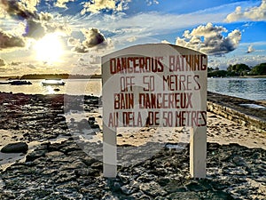Dangerous bathing sign in Pointe D'Esny, Mauritius.