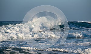 Dangerous big stormy waves during a windstorm at the sea