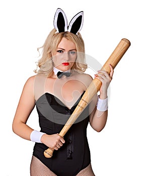 Dangerous blonde woman in rabbit costume with bat
