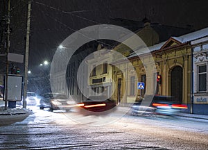 Dangerous car situation in motion blur at night in winter