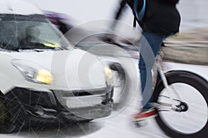 Dangerous city traffic situation with cyclist and car