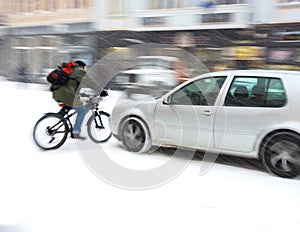 Dangerous city traffic situation with cyclist and car