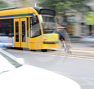 Dangerous city traffic situation with cyclist and tram