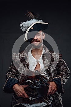 Dangerous corsair dressed in pirate outfit and hat