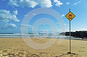 Dangerous Current Warning Sign on Beach