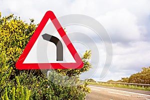 Dangerous curve ahead warning traffic sign