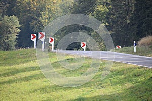dangerous curve with arrow signs made of plastic