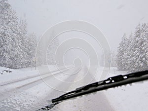 Dangerous driving during blizzard on rural highway