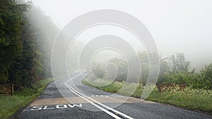 Dangerous driving on road in fog: slow mark