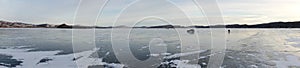 Dangerous fishing on the melting ice of the Big Lake in spring. Sharypovsky district. Krasnoyarsk region. Russia