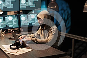 Dangerous hacker working on security breach