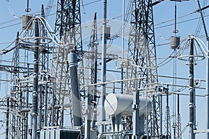 Dangerous High Voltage Electrical Power Substation against cloudless blue sky XV