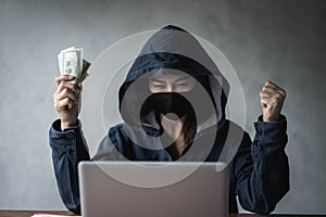 Dangerous Hooded Hacker held the money