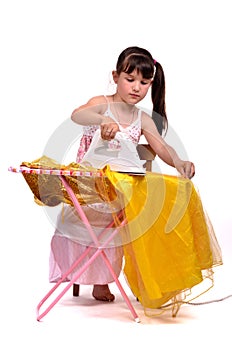 Dangerous housework-little girl ironing her dress