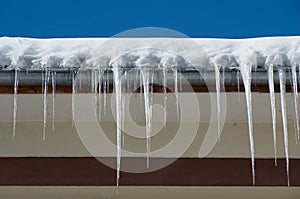 Dangerous icicles. Fines for snow and ice on roofs.