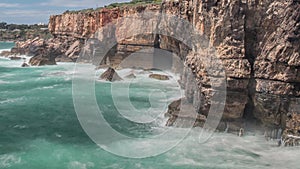 Dangerous ocean waves crash into cliff, Devil Mouth Boca do Inferno, Portugal