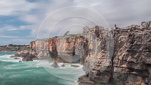 Dangerous ocean waves crash into cliff, Devil Mouth Boca do Inferno, Portugal