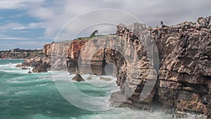 Dangerous ocean waves crash into cliff, Devil Mouth Boca do Inferno, Portugal