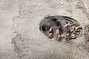 Dangerous opened manhole hole cover, danger for people who walking on the street in the city