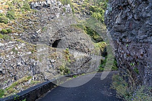 Dangerous part of the old road with rockfall